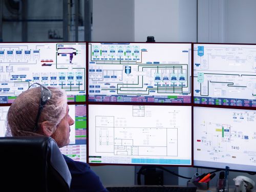 Six monitors on which production processes are displayed.